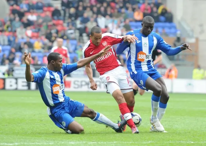 Framed Print : Theo Walcott (Arsenal) Maynor Figueroa and Mohamed Diame (Wigan). Wigan Athletic 3 Framed Print : Theo Walcott (Arsenal) Maynor Figueroa and Mohamed Diame (Wigan). Wigan Athletic 3