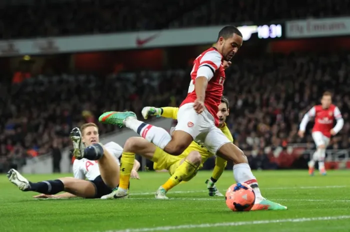 Framed Print : Theo Walcott (Arsenal) Michael Dawson and Hugo Lloris (Tottenham). Arsenal 2: 0 Tottenham Hotspur Framed Print : Theo Walcott (Arsenal) Michael Dawson and Hugo Lloris (Tottenham). Arsenal 2: 0 Tottenham Hotspur