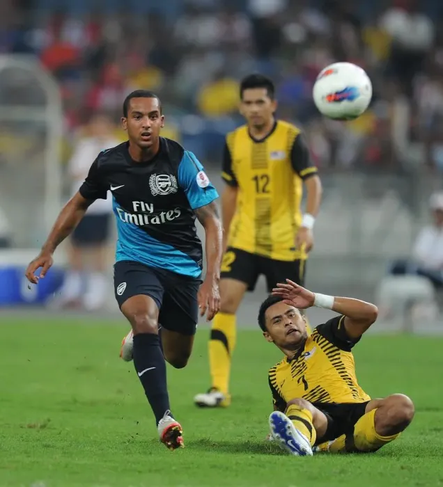 Framed Print : Theo Walcott (Arsenal) Mohd Zafuan (Malaysia). Malaysia XI 0: 4 Arsenal Framed Print : Theo Walcott (Arsenal) Mohd Zafuan (Malaysia). Malaysia XI 0: 4 Arsenal