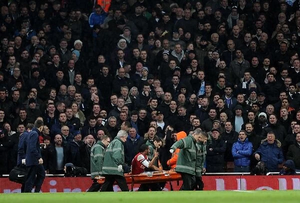 Theo Walcott (Arsenal) is stretchered from the pitch. Arsenal 2: 0 Tottenham Hotspur