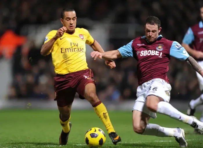 Framed Print : Theo Walcott (Arsenal) is trippede by West Ham defender Wayne Bridge. West Ham United 0 Framed Print : Theo Walcott (Arsenal) is trippede by West Ham defender Wayne Bridge. West Ham United 0