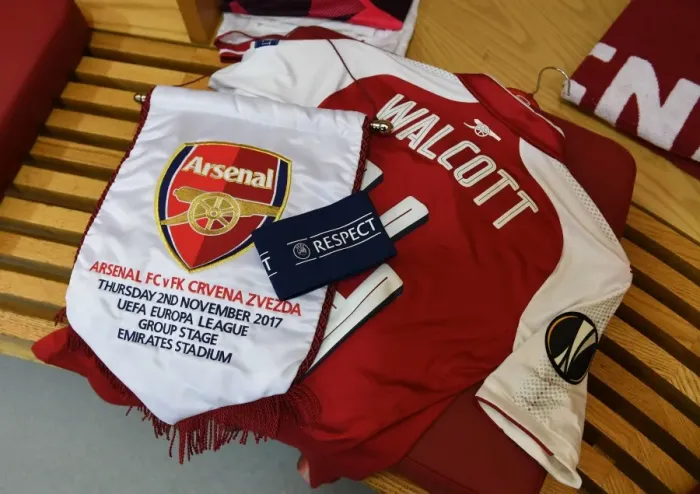 Framed Print : Theo Walcott Celebrates Europa League Victory with Arsenal Pennant (Arsenal vs Crvena Zvezda, 2017) Framed Print : Theo Walcott Celebrates Europa League Victory with Arsenal Pennant (Arsenal vs Crvena Zvezda, 2017)