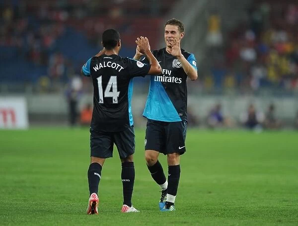 Theo Walcott celebrates scoring the 2nd Arsenal goal with Aaron Ramsey