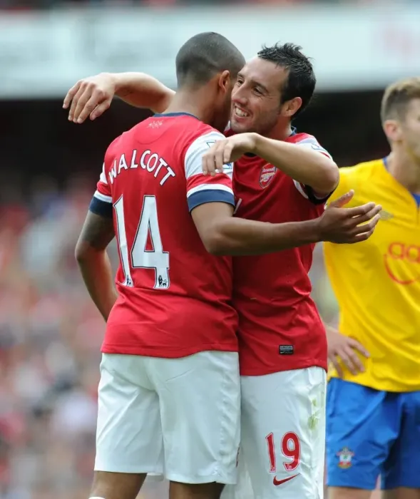 Framed Print : Theo Walcott celebrates scoring the 6th Arsenal goal with Santi Cazorla Framed Print : Theo Walcott celebrates scoring the 6th Arsenal goal with Santi Cazorla