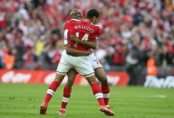 Theo Walcott celebrates scoring the Arsenal goal with Abou Diaby