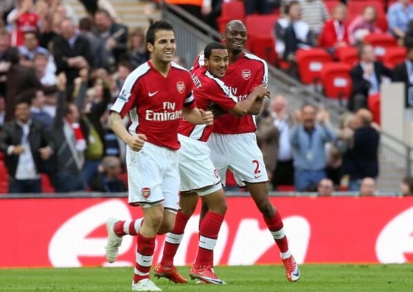 Theo Walcott celebrates scoring Arsenals goal with