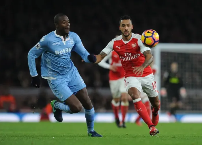 Framed Print : Theo Walcott Closes Down Giannelli Imbula in Intense Arsenal v Stoke City Premier League Clash