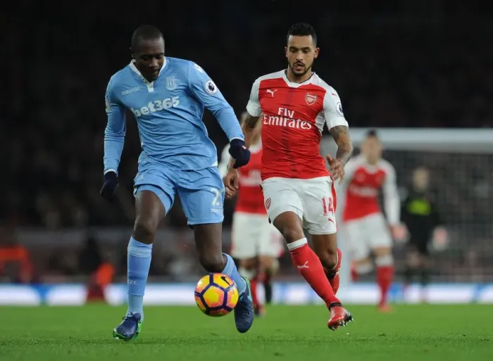 Framed Print : Theo Walcott Closes In on Giannelli Imbula: Intense Moment from Arsenal vs Stoke City, Premier League 2016-17 Framed Print : Theo Walcott Closes In on Giannelli Imbula: Intense Moment from Arsenal vs Stoke City, Premier League 2016-17