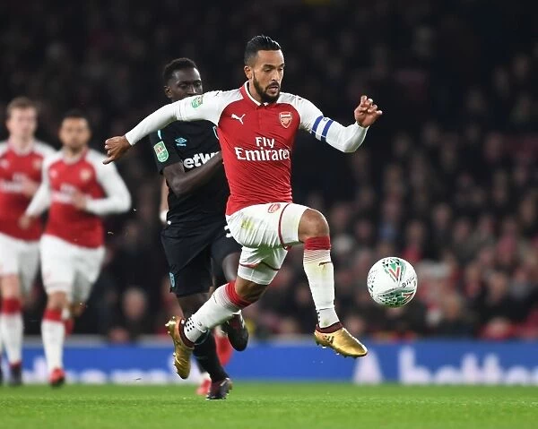 Theo Walcott Dashes Past Domingos Quina in Carabao Cup Quarterfinal Clash: Arsenal vs. West Ham United