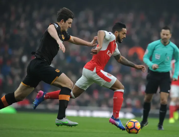 Framed Print : Theo Walcott Dashes Past Harry Maguire: Arsenal vs. Hull City, Premier League 2016-17 Framed Print : Theo Walcott Dashes Past Harry Maguire: Arsenal vs. Hull City, Premier League 2016-17