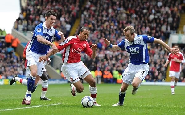 Theo Walcott Faces Off Against Birmingham Duo Liam Ridgewell and Lee Bowyer in Intense Barclays Premier League Clash