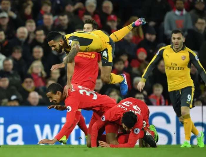 Framed Print : Theo Walcott Faces Off Against Matip and Can in Intense Liverpool vs. Arsenal Premier League Clash Framed Print : Theo Walcott Faces Off Against Matip and Can in Intense Liverpool vs. Arsenal Premier League Clash