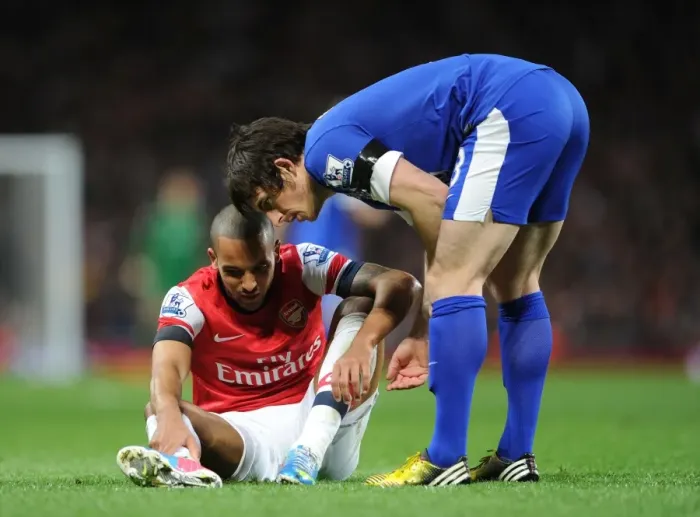 Framed Print : Theo Walcott and Leighton Baines: A Moment of Respite Amidst the Arsenal v Everton Rivalry Framed Print : Theo Walcott and Leighton Baines: A Moment of Respite Amidst the Arsenal v Everton Rivalry