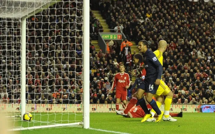 Framed Print : Theo Walcott looks on as Glen Johnson put through his own net for the 1st Arsenal goal