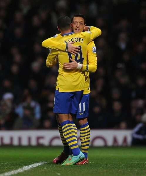 Theo Walcott and Mesut Ozil Celebrate Arsenal's Second Goal vs. West Ham United (2013-14)