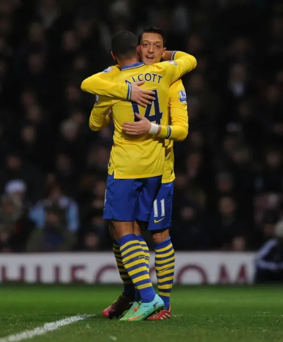 Framed Print : Theo Walcott and Mesut Ozil Celebrate Arsenal's Second Goal vs. West Ham United (2013-14) Framed Print : Theo Walcott and Mesut Ozil Celebrate Arsenal's Second Goal vs. West Ham United (2013-14)