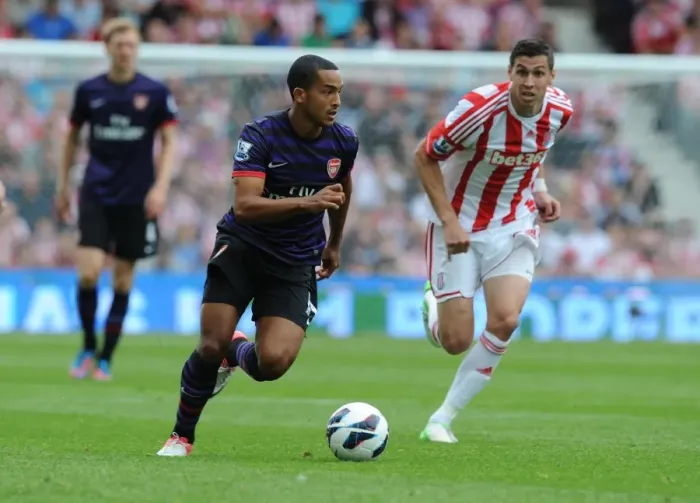 Framed Print : Theo Walcott Outmaneuvers Geoff Cameron: A Pivotal Moment from Stoke City vs. Arsenal (2012-13)