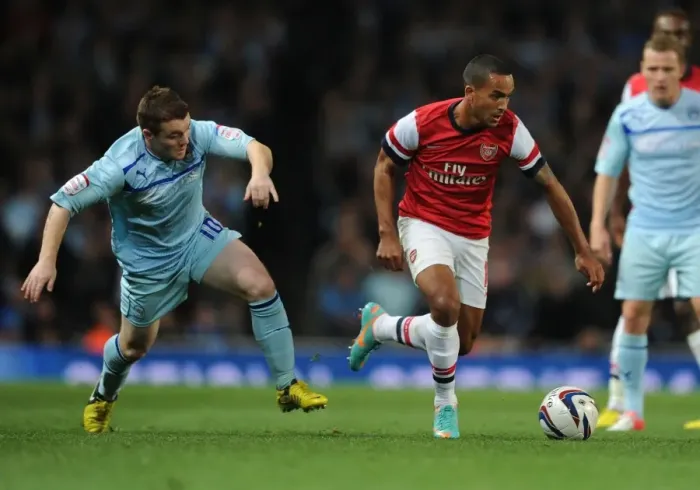 Framed Print : Theo Walcott Outmaneuvers John Fleck in Arsenal's Capital One Cup Victory Framed Print : Theo Walcott Outmaneuvers John Fleck in Arsenal's Capital One Cup Victory