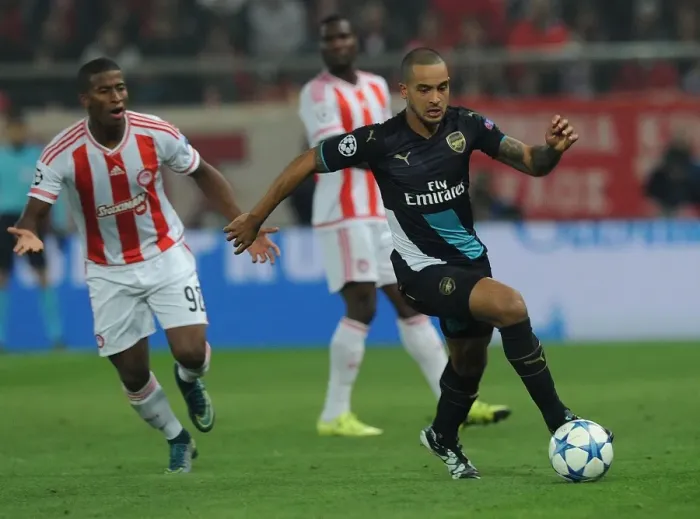 Framed Print : Theo Walcott Outmaneuvers Seba: A Champions League Showdown at Olympiacos (2015)