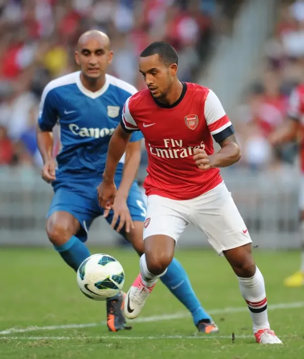Framed Print : Theo Walcott Outmaneuvers Zeshan Rehman: Kitchee FC vs. Arsenal FC, 2012