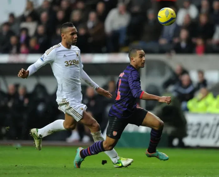 Framed Print : Theo Walcott Outpaces Kyle Bartley in FA Cup Clash: Swansea vs Arsenal (2012-13) Framed Print : Theo Walcott Outpaces Kyle Bartley in FA Cup Clash: Swansea vs Arsenal (2012-13)