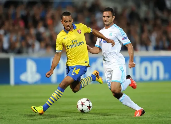 Framed Print : Theo Walcott Outruns Jeremy Morel: Marseille vs. Arsenal, UEFA Champions League, 2013