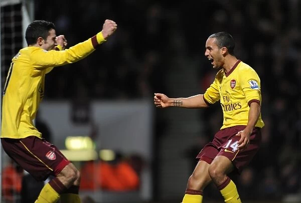 Theo Walcott and Robin van Persie: A Dazzling Duo Celebrates Arsenal's Second Goal Against West Ham United