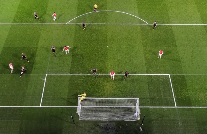 Framed Print : Theo Walcott scores Arsenal 2nd goal past Pepe Reina (Liverpool). Arsenal 2: 2 Liverpool