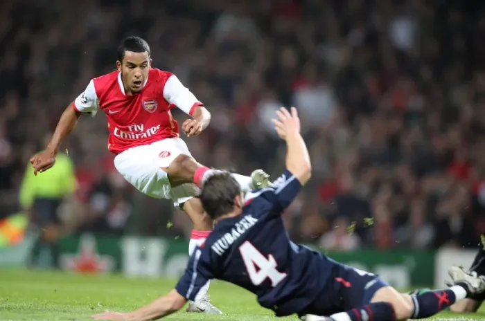 Framed Print : Theo Walcott scores Arsenals 3rd goal, his 1st past David Hubacek (Slavia) Framed Print : Theo Walcott scores Arsenals 3rd goal, his 1st past David Hubacek (Slavia)