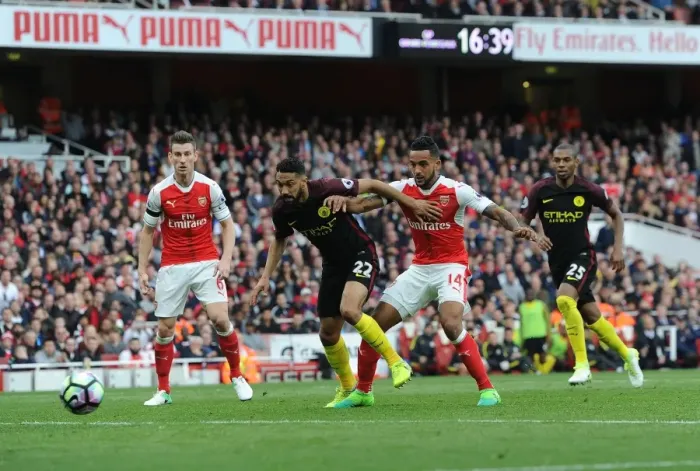 Framed Print : Theo Walcott Scores Dramatic Goal Against Manchester City in Premier League Showdown Framed Print : Theo Walcott Scores Dramatic Goal Against Manchester City in Premier League Showdown