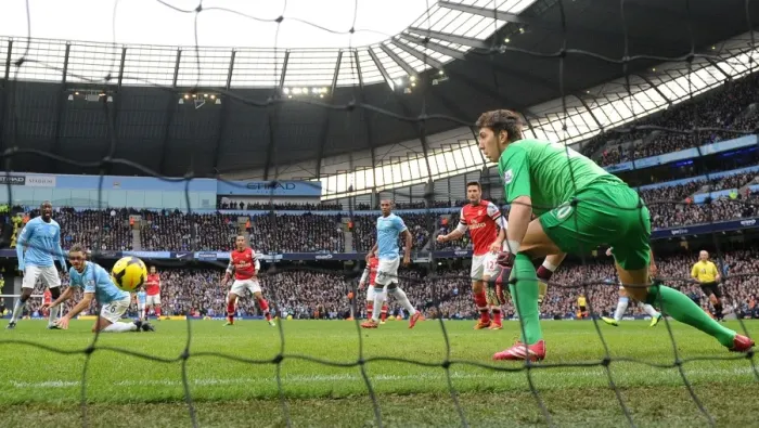 Framed Print : Theo Walcott Scores Against Manchester City: Yaya Toure, Martin Demichelis, and Costel Pantilimon