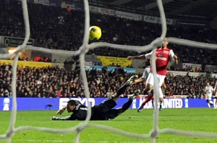 Framed Print : Theo Walcott Scores Against Michel Vorm: Swansea City vs. Arsenal, Premier League 2011-12