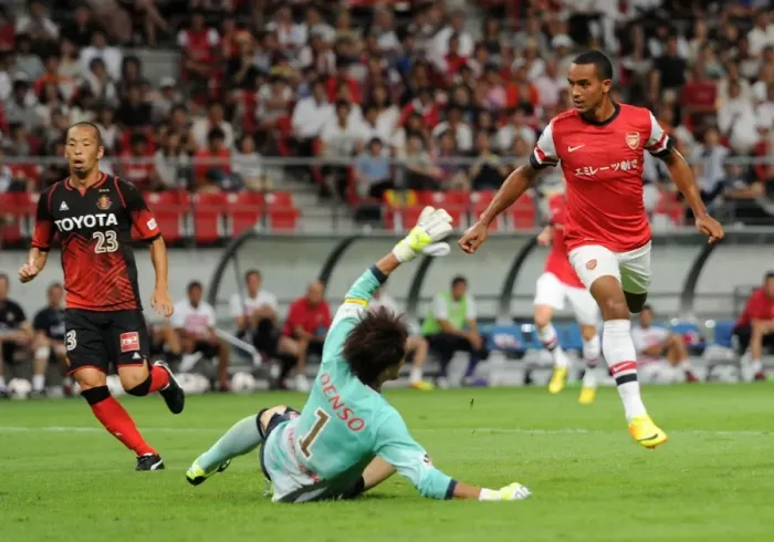Framed Print : Theo Walcott Scores Against Nagoya Grampus in Arsenal's 2013 Pre-Season Match