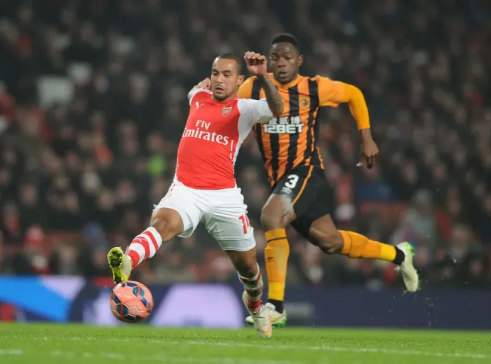 Framed Print : Theo Walcott Surges Past Hull's Maynor Figeroa in FA Cup Third Round Clash at Arsenal's Emirates Stadium Framed Print : Theo Walcott Surges Past Hull's Maynor Figeroa in FA Cup Third Round Clash at Arsenal's Emirates Stadium