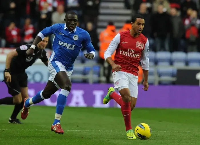 Framed Print : Theo Walcott Surges Past Mohamed Diame: Wigan Athletic vs. Arsenal, Premier League 2011-12 Framed Print : Theo Walcott Surges Past Mohamed Diame: Wigan Athletic vs. Arsenal, Premier League 2011-12