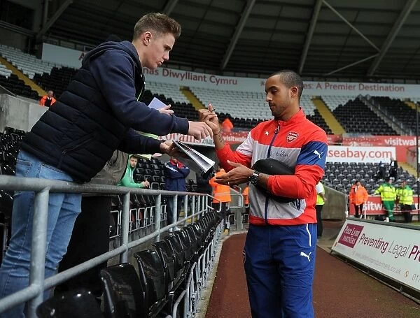 Theo Walcott at Swansea: Arsenal Star Signs Autographs Ahead of Premier League Clash