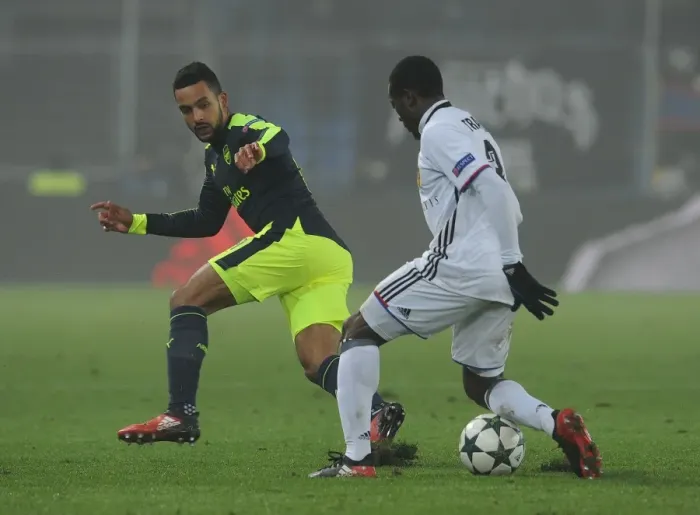Framed Print : Theo Walcott vs Adama Traore: Clash in the UEFA Champions League between FC Basel and Arsenal