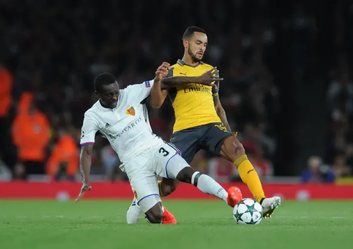Framed Print : Theo Walcott vs Adama Traore: A Clash of Wings at the Emirates
