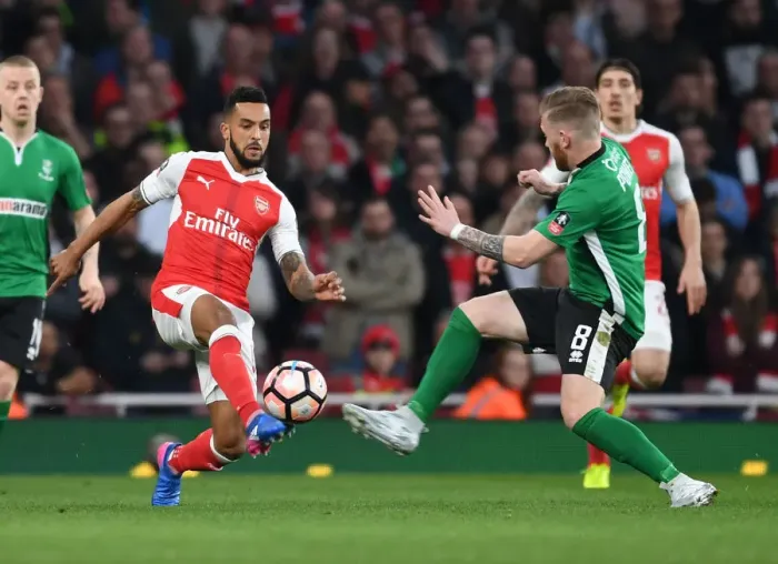 Framed Print : Theo Walcott vs Alan Power: Arsenal vs Lincoln City - Emirates FA Cup Quarter-Final Showdown