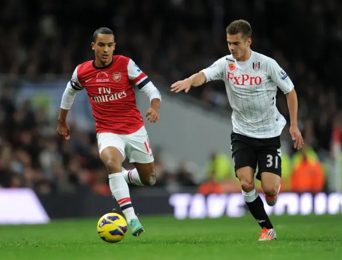 Framed Print : Theo Walcott vs. Alex Kacaniklic: A Battle at Emirates Stadium (Arsenal v Fulham, 2012-13) Framed Print : Theo Walcott vs. Alex Kacaniklic: A Battle at Emirates Stadium (Arsenal v Fulham, 2012-13)