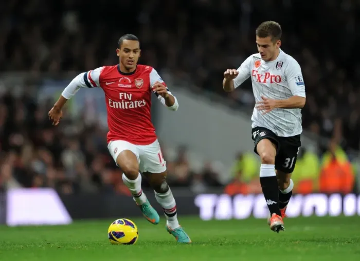 Framed Print : Theo Walcott vs. Alex Kacaniklic: A Premier League Showdown at Emirates Stadium (2012-13)