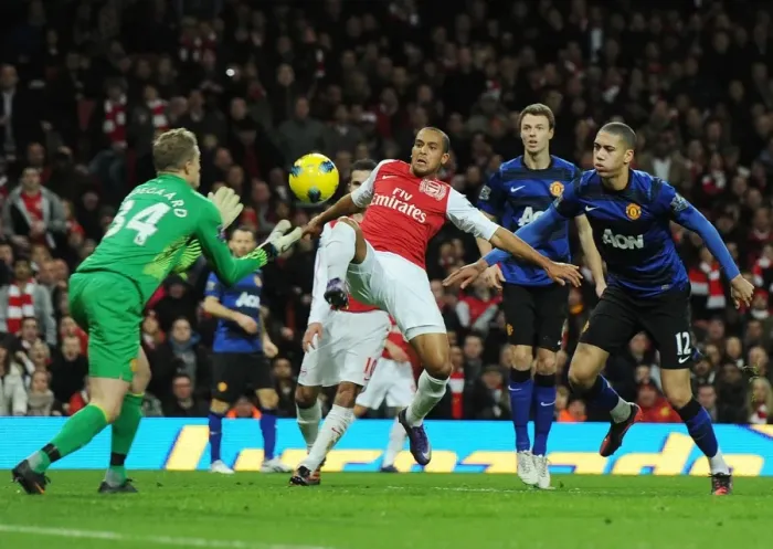 Framed Print : Theo Walcott vs. Anders Lindegaard: Intense Battle at the Emirates - Arsenal vs. Manchester United, Premier League 2011-12 Framed Print : Theo Walcott vs. Anders Lindegaard: Intense Battle at the Emirates - Arsenal vs. Manchester United, Premier League 2011-12
