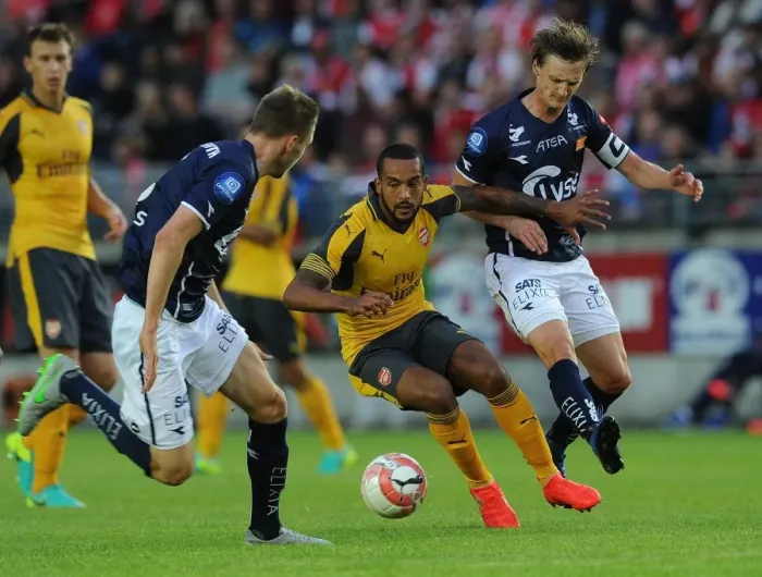 Framed Print : Theo Walcott vs. Andre Danielsen: A Clash in Pre-Season Friendly between Viking FK and Arsenal