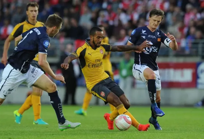 Framed Print : Theo Walcott vs. Andre Danielsen: A Pre-Season Clash at Viking Stadion Framed Print : Theo Walcott vs. Andre Danielsen: A Pre-Season Clash at Viking Stadion