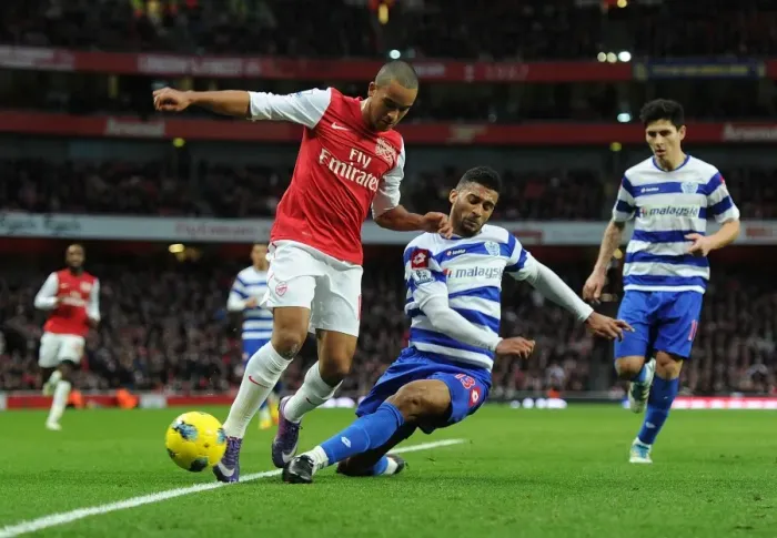 Framed Print : Theo Walcott vs. Armand Traore: A Battle in the Arsenal v Queens Park Rangers Premier League Clash (December 2011) Framed Print : Theo Walcott vs. Armand Traore: A Battle in the Arsenal v Queens Park Rangers Premier League Clash (December 2011)