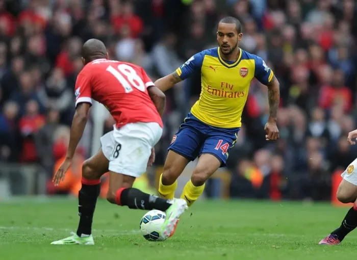 Framed Print : Theo Walcott vs Ashley Young: A Riveting Clash at Old Trafford - Manchester United vs Arsenal, Premier League 2014-15 Framed Print : Theo Walcott vs Ashley Young: A Riveting Clash at Old Trafford - Manchester United vs Arsenal, Premier League 2014-15