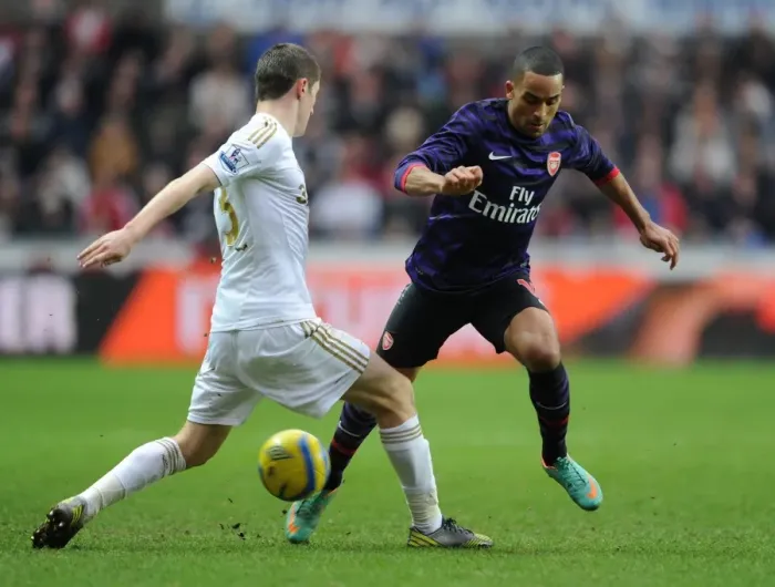Framed Print : Theo Walcott vs Ben Davies: Clash in the FA Cup Third Round between Swansea and Arsenal
