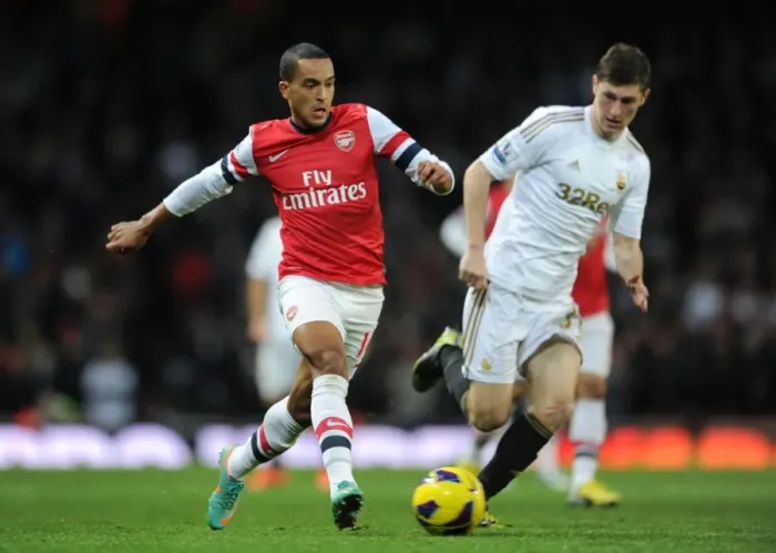 Framed Print : Theo Walcott vs. Ben Davies: A Premier League Battle at Emirates Stadium (Arsenal vs. Swansea, 2012-13) Framed Print : Theo Walcott vs. Ben Davies: A Premier League Battle at Emirates Stadium (Arsenal vs. Swansea, 2012-13)