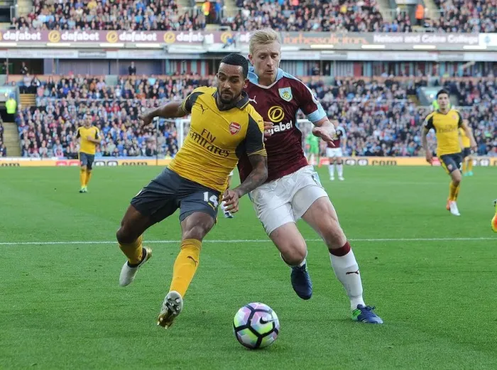 Framed Print : Theo Walcott vs Ben Mee: A Premier League Showdown at Burnley's Turf Moor (2016-17)