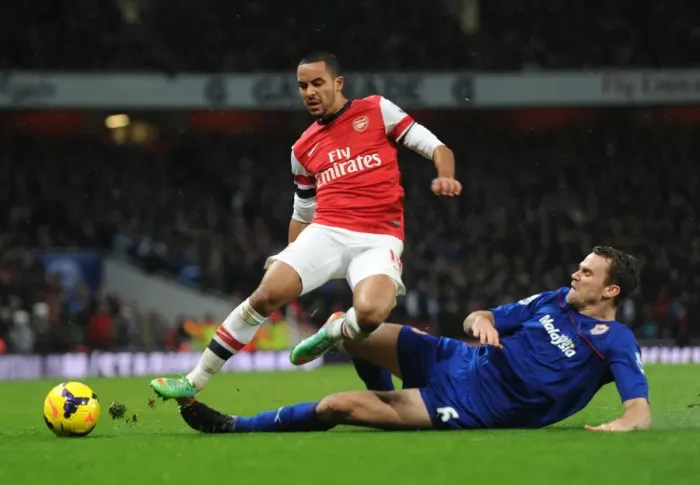 Framed Print : Theo Walcott vs Ben Turner: A Footballing Battle at the Emirates - Arsenal vs Cardiff City, Premier League 2013-14 Framed Print : Theo Walcott vs Ben Turner: A Footballing Battle at the Emirates - Arsenal vs Cardiff City, Premier League 2013-14